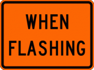 WHEN FLASHING (W16-13) Construction Sign