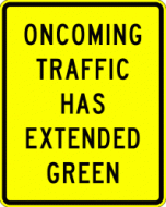 ONCOMING TRAFFIC HAS EXTENDED GREEN (W25-1)